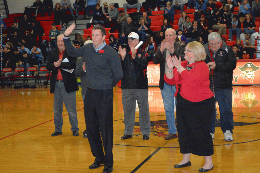 Andrew Janes (left), class of 2001, and Angie Shockley were inducted to the WCHS Athletic Hall of Fame on February 5 right before the boys varsity basketball game at Fairborn. 