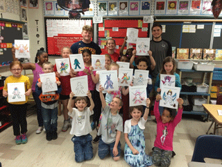 Seniors Colton Abner, Nicolas Wainscot, and Chad Holland promoting
literacy with CF Holliday students. After reading “Where the
Wild Things Are,” they created their own wild thing. Students then
selected a book to take home. 