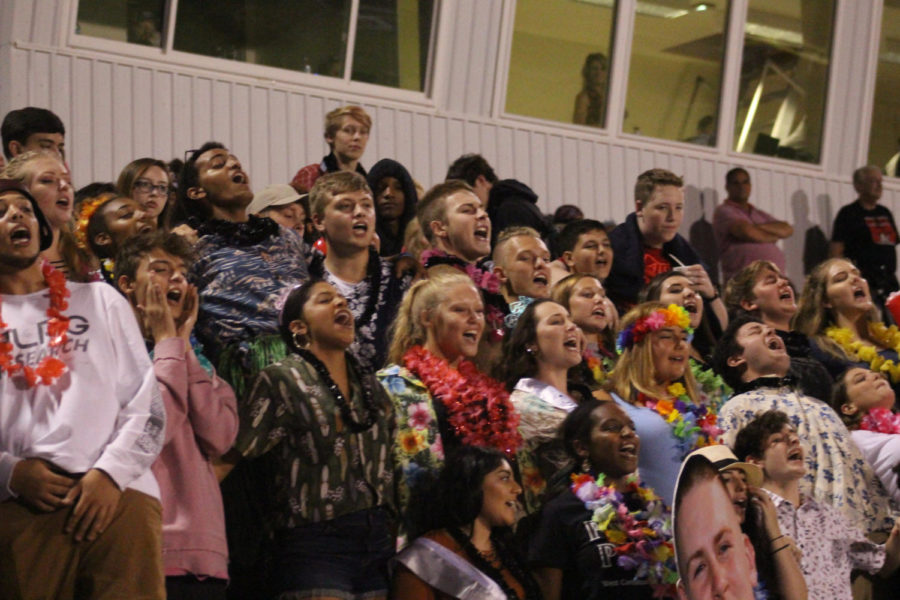 Students+cheering+at+the+2017+homecoming+game+at+our+home+field+against+Fairmont.+Students+dressed+tropical+and+screamed+with+spirit.